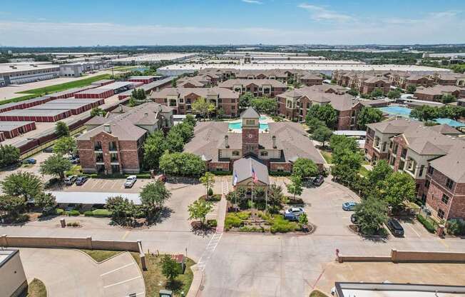 A large, open courtyard surrounded by brick buildings.