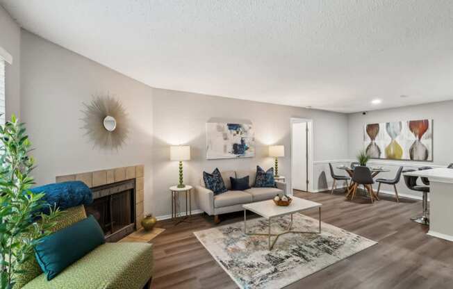 A living room with a fireplace, a couch, and a coffee table.
