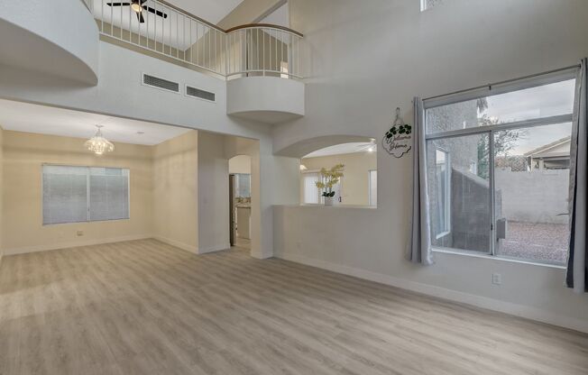 Elegant kitchen open to family room with fireplace.