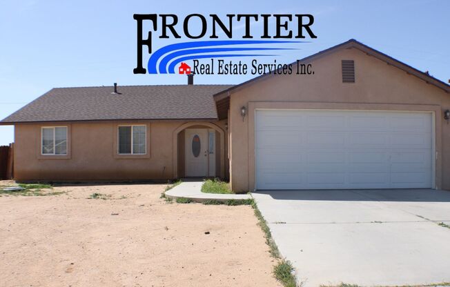 Charming 3-Bedroom Home with Fireplace, Spacious Backyard & Attached Garage in California City!