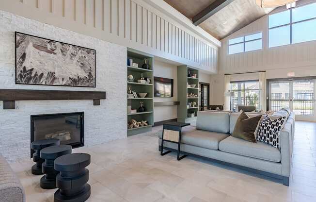 a living room with a couch and a fireplace