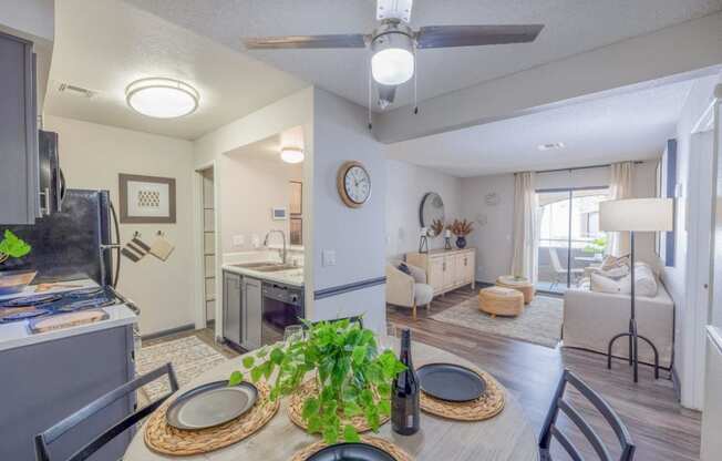 an open living room and kitchen with a dining table