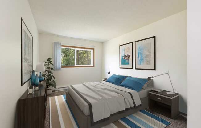 Bismarck, ND Bradbury Apartments. a bedroom with blue accents. The large window brightens the interior with natural light. The bed, dresser, and wall art make for a comforting appearance.
