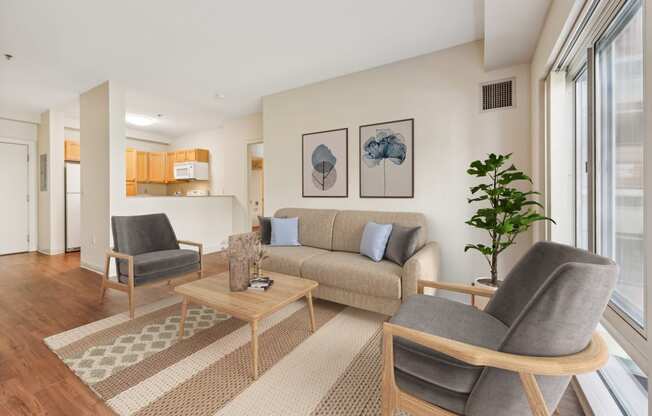 a living room with a couch and two chairs at Residences at Manchester Place in Manchester New Hampshire