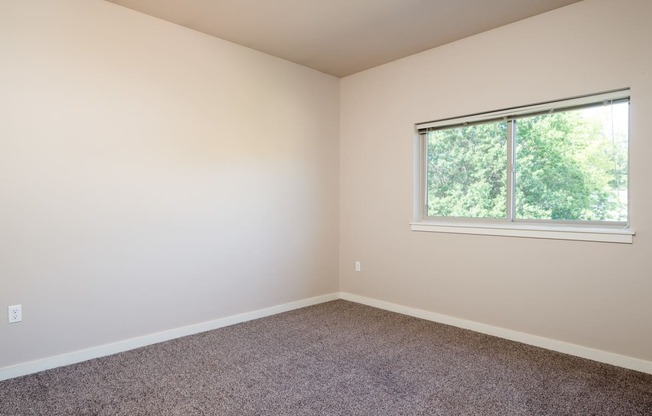 an empty room with a large window