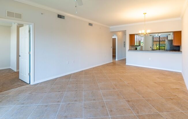Stunning 2BR/2BA Acqua Ct. First-Floor Unit with Lake Views in Treviso Bay – Resort-Style Living Awaits!