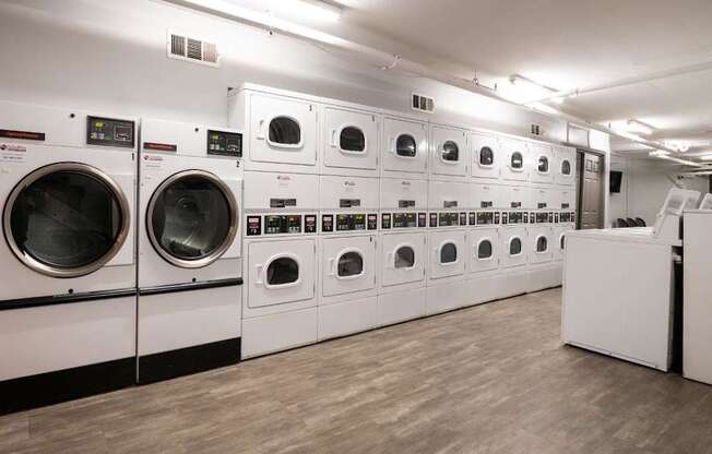 A row of washing machines in a laundromat.