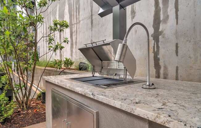 a kitchen counter with a sink and a faucet