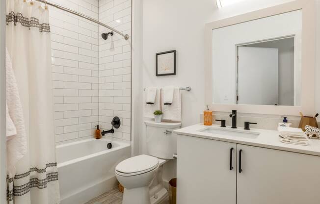 Model bathroom with a toilet sink and tub