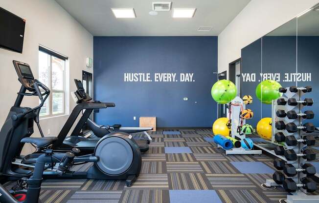 A gym with a wall that says