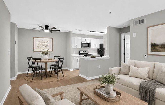 A living room with a dining table and chairs.