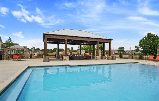 A pool with a pavilion over it.