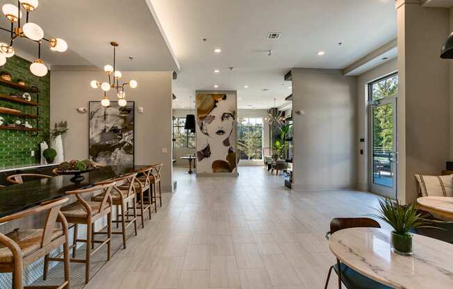 a large room with a bar and tables and chairs