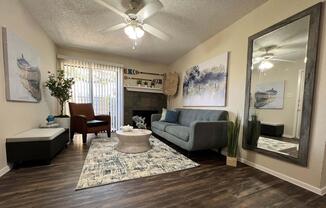 a living room filled with furniture and a fireplace