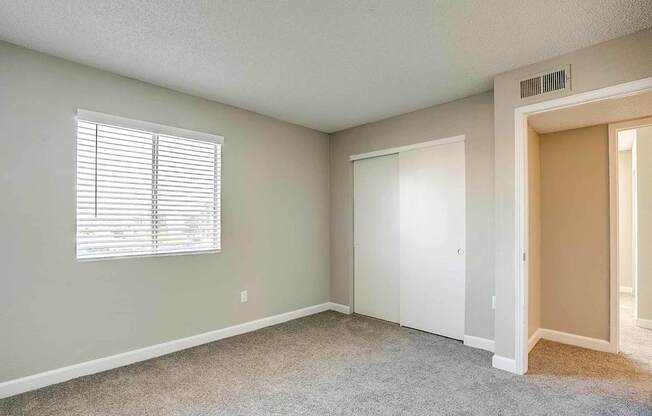 A room with a window and a door at Sterling Point Apartment Homes, Phoenix, Arizona
