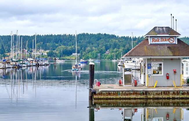a dock on the water with boats in a marina at Woodcreek, Poulsbo Washington