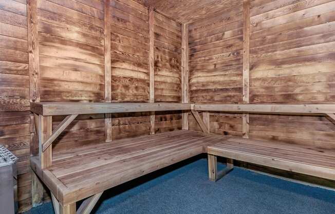 a large sauna with a bench and table at Lincoln Village Apartments, Spokane, WA