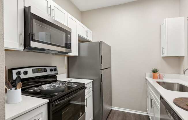 the preserve at ballantyne commons apartment kitchen with stainless steel appliances
