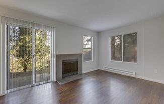 Nickel Creek Apartments in Lynwood, Washington Living Room with Fireplace and Private Patio