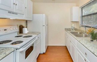 Prepare meals with ease in kitchens equipped with contemporary appliances, ample cabinetry, and functional layouts.