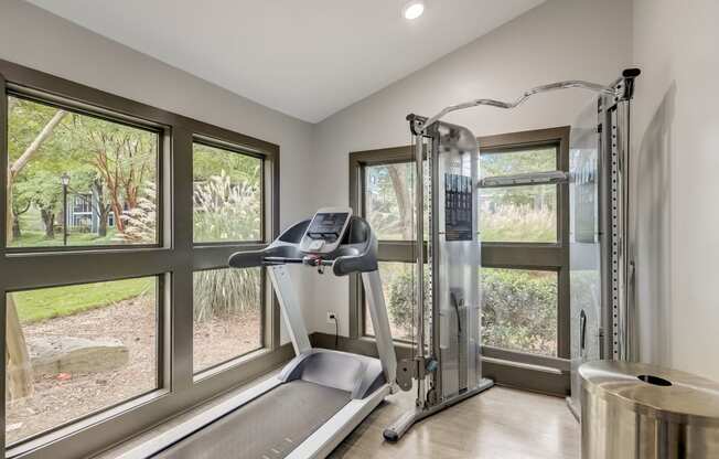 Wynnwood Vinings Atlanta fitness center room with windows and a treadmill