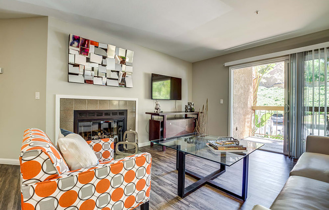 Living Room with fireplace and patio