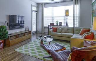 Living Room with Private Patio Access at 4700 Colonnade Apartments in Birmingham, AL