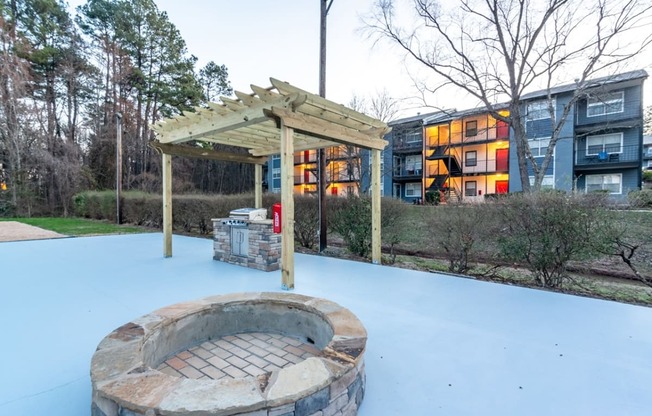 a fire pit and a pavilion in the snow