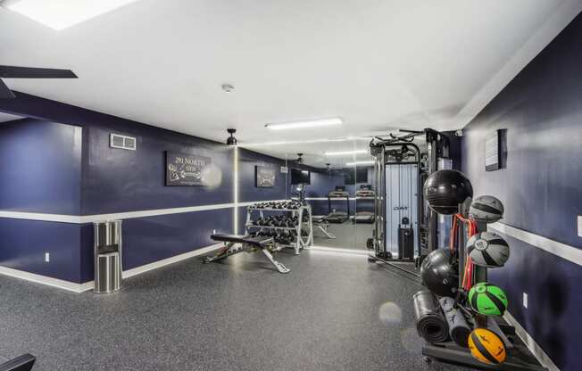 the gym is equipped with weights and other workout equipment