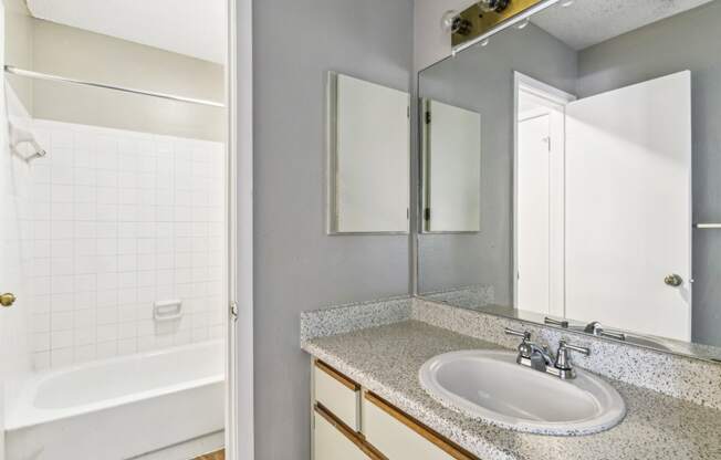 Modern bathroom with soaking tub at Bandera Crossing apartments in San Antonio, TX