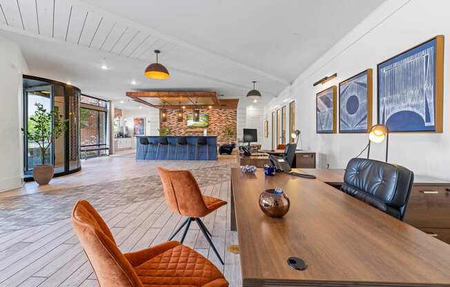 a living room with a wooden table and leather chairs