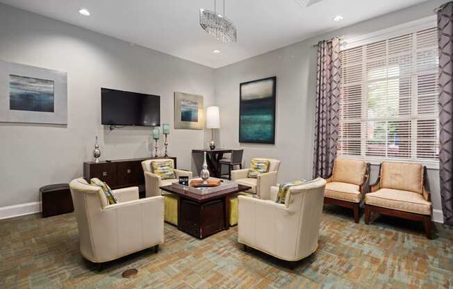 A living room with a sofa, armchair, and coffee table.
