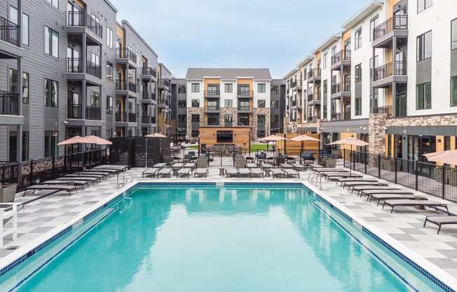 a swimming pool in the middle of an apartment building