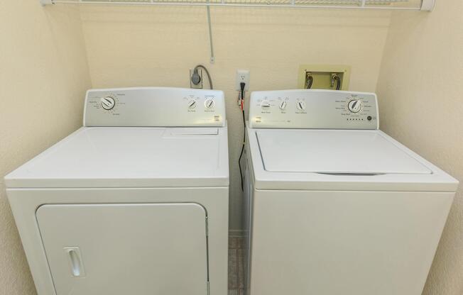 a microwave oven sitting on top of a refrigerator