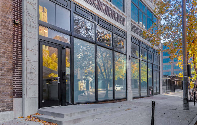 A building with a brick facade and large windows.