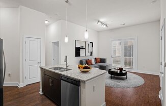 a kitchen and living room with a counter top