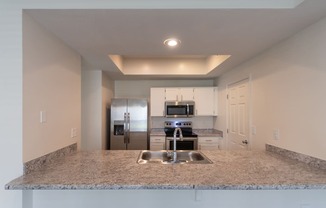 This is a photo of the kitchen of the 1500 square foot 3 bedroom, 2 and a half bath with 2-car garage Bellbrook floor plan at Washington Park Apartments in Centerville, OH.