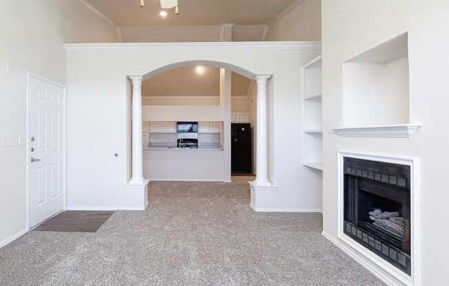 Spacious living rooms and archways at Turnberry Isle Apartments in Dallas, TX.