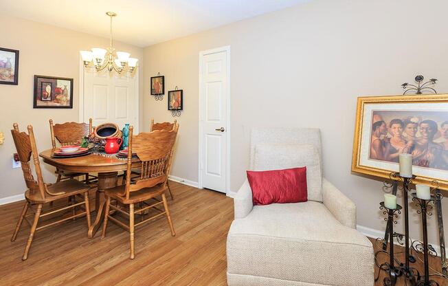 a living room filled with furniture on top of a wooden floor