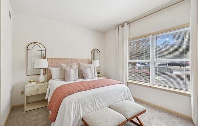 Spacious bedroom with natural light and neutral decor in Tattersall Village Apartments, Hinesville, GA