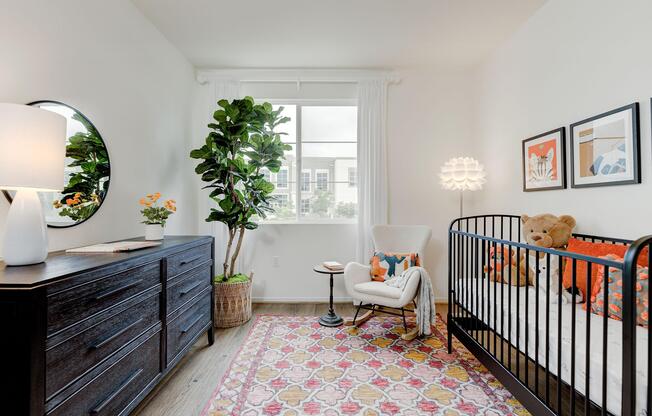 a living room filled with furniture and a large window