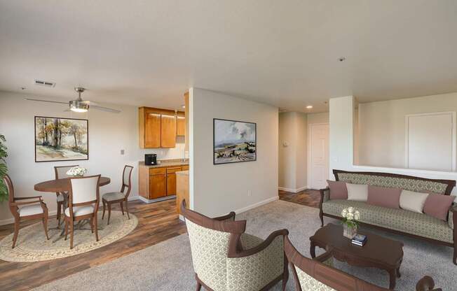 A living room with a couch, chairs, and a coffee table.