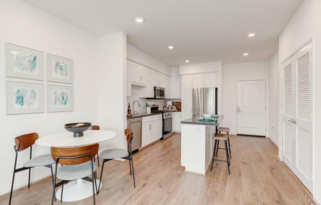 a kitchen with a table in a room