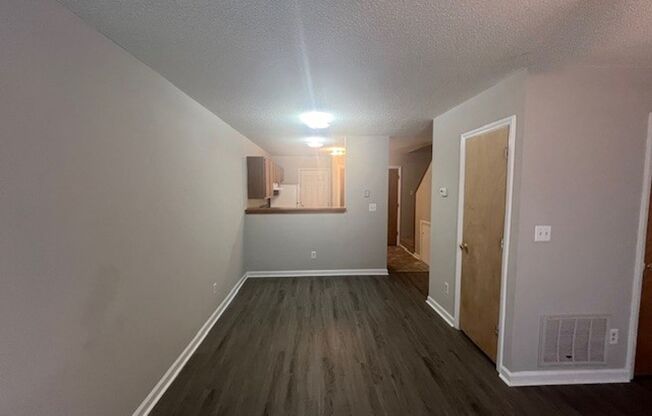 New Flooring!  New Paint!  Convenient to Schools & Shopping!  Lots of Closet Space!