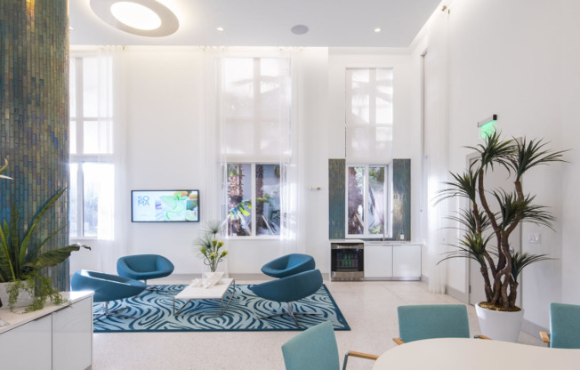 Luxurious lounge with blue seating and decor in an apartment building near Miami Beach.