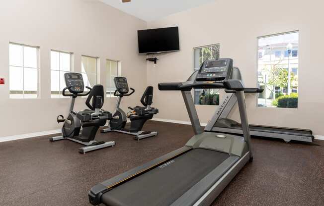 fitness center treadmill and recumbent bikes