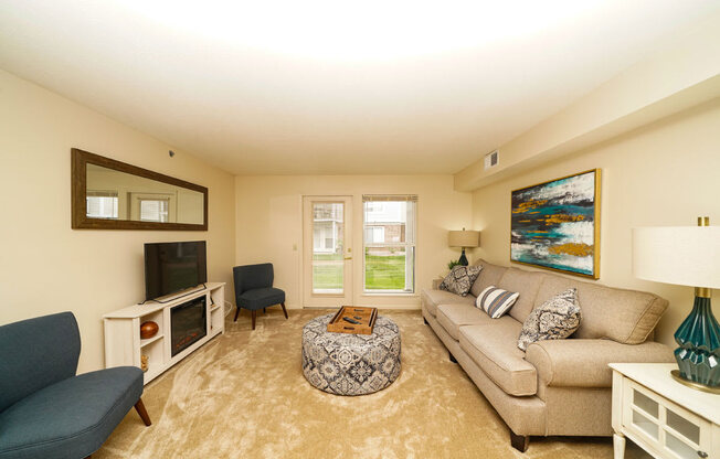 Living Rooms with Carpeting at Brentwood Park Apartments, La Vista, NE