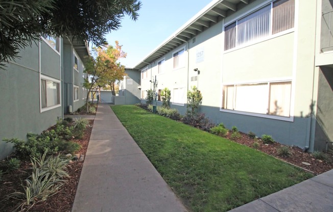 The Canopy | Exterior Building and Pathway with Landscaping