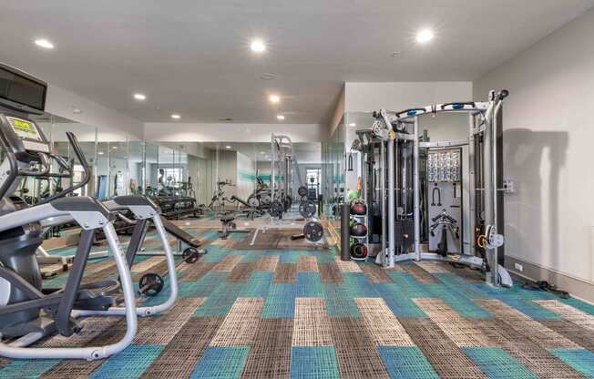 fitness center with cardio and strength training equipment