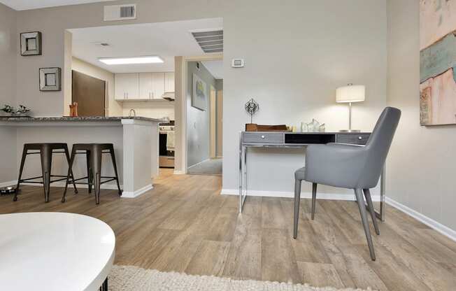wood-style flooring and model furnishings in the model 1-bedroom apartment at The Oasis Daytona